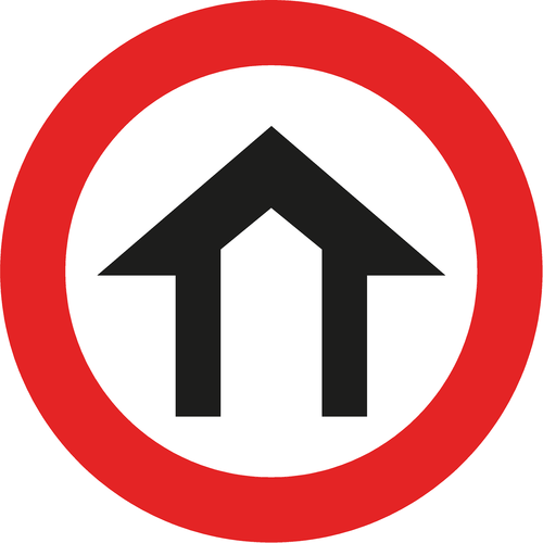 A road sign with a red circle border and a black house symbol in the center, indicating the start of a built-up or residential area.